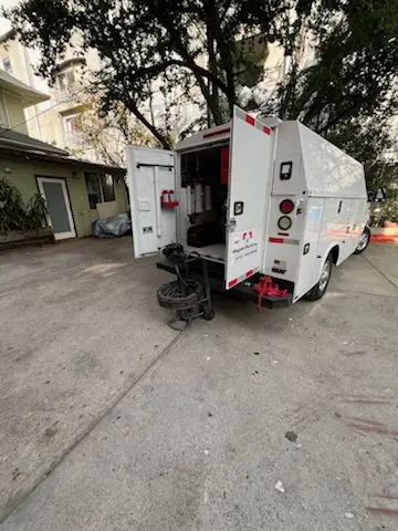 Magnet Plumbing service vehicle on-site for Grease Trap Cleaning in Okeechobee
